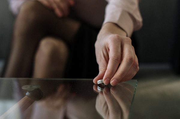 Woman setting down wedding ring